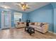 Light-filled living room with neutral furniture and lake views at 561 Juniper Springs Dr, Groveland, FL 34736