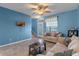 Living room with neutral furniture and lake views at 561 Juniper Springs Dr, Groveland, FL 34736