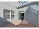 Small patio accessible from sliding glass door at 561 Juniper Springs Dr, Groveland, FL 34736