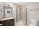 Bathroom with shower, vanity, and toilet at 10013 Stockbridge St, Clermont, FL 34711