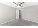 Spacious bedroom with ceiling fan and carpeted floor at 10013 Stockbridge St, Clermont, FL 34711