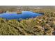 Aerial view of expansive lakefront property with multiple homes at 10285 Ne 218Th Lane Rd, Fort Mc Coy, FL 32134