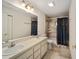 Bathroom with double sinks, shower/tub combo and tile floor at 10285 Ne 218Th Lane Rd, Fort Mc Coy, FL 32134