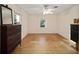 Spacious bedroom with wood floors and ample natural light at 10285 Ne 218Th Lane Rd, Fort Mc Coy, FL 32134