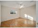 Bright bedroom with ceiling fan and hardwood floors at 10285 Ne 218Th Lane Rd, Fort Mc Coy, FL 32134