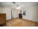 Simple bedroom featuring wood flooring and ceiling fan at 10285 Ne 218Th Lane Rd, Fort Mc Coy, FL 32134