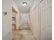 Long hallway with tile flooring and built-in shelving at 10285 Ne 218Th Lane Rd, Fort Mc Coy, FL 32134