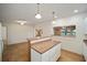 Bright kitchen with white cabinets, and a breakfast bar at 10285 Ne 218Th Lane Rd, Fort Mc Coy, FL 32134