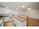 Modern kitchen featuring white cabinetry and a large island at 10285 Ne 218Th Lane Rd, Fort Mc Coy, FL 32134