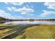 Scenic view of a lake with lush green grass at 10285 Ne 218Th Lane Rd, Fort Mc Coy, FL 32134