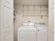 Laundry room with washer, dryer and shelving at 10285 Ne 218Th Lane Rd, Fort Mc Coy, FL 32134