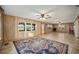 Large living room with water views, tile floors, and ceiling fan at 10285 Ne 218Th Lane Rd, Fort Mc Coy, FL 32134
