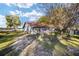 Side yard with grassy area, trees, and a chain link fence at 10285 Ne 218Th Lane Rd, Fort Mc Coy, FL 32134