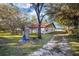 Large side yard with mature trees and water tank at 10285 Ne 218Th Lane Rd, Fort Mc Coy, FL 32134
