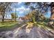 Spacious side yard with mature trees and a view of the lake at 10285 Ne 218Th Lane Rd, Fort Mc Coy, FL 32134