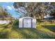 White metal storage shed in grassy backyard at 10285 Ne 218Th Lane Rd, Fort Mc Coy, FL 32134