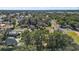 Neighborhood aerial view showcasing a suburban landscape with lush trees and homes at 105 W Stevens Ave, Eustis, FL 32726