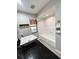 Modern bathroom with a large vanity and a bathtub at 1107 N Valencia Ave, Howey In The Hills, FL 34737