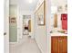 Bathroom with sink, vanity, and view of hallway at 1214 Loch Rannoch Ct, Leesburg, FL 34788