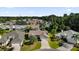 Aerial view of a residential neighborhood with houses and landscaping at 1303 De La Garza Pl, The Villages, FL 32162