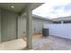 Small, private backyard with a covered patio and AC unit at 13245 Peaceful Melody Dr, Winter Garden, FL 34787