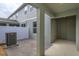 Private backyard with a covered patio and AC unit at 13245 Peaceful Melody Dr, Winter Garden, FL 34787