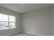 Well-lit bedroom with neutral walls and plush carpeting at 13245 Peaceful Melody Dr, Winter Garden, FL 34787
