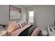 Cozy bedroom with a comfortable bed and stylish accents at 13245 Peaceful Melody Dr, Winter Garden, FL 34787