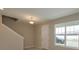 Entryway with neutral tones, wood-look floors and a view to the backyard at 13245 Peaceful Melody Dr, Winter Garden, FL 34787