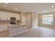 Modern kitchen with white cabinets, quartz countertops, and a breakfast bar at 13245 Peaceful Melody Dr, Winter Garden, FL 34787
