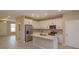 Modern kitchen with white cabinets, quartz countertops, and stainless steel appliances at 13245 Peaceful Melody Dr, Winter Garden, FL 34787