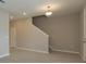 Modern staircase leading to the upper level of the home at 13245 Peaceful Melody Dr, Winter Garden, FL 34787