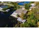House on the lake with dock and boathouse at 13724 Country Club Dr, Tavares, FL 32778