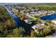 Community overview, lakefront homes and canal at 13724 Country Club Dr, Tavares, FL 32778