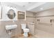 Accessible bathroom with walk-in shower at 13724 Country Club Dr, Tavares, FL 32778