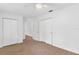 Spacious bedroom with double closets and neutral carpeting at 13724 Country Club Dr, Tavares, FL 32778