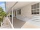 Covered patio alongside canal, offering peaceful water views at 13724 Country Club Dr, Tavares, FL 32778