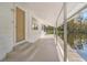 Covered patio with water views and access to a canal at 13724 Country Club Dr, Tavares, FL 32778