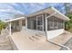 White house exterior with screened porch and canal view at 13724 Country Club Dr, Tavares, FL 32778