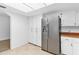 Kitchen boasts stainless steel appliances and ample cabinet space at 13724 Country Club Dr, Tavares, FL 32778