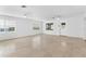 Spacious living area featuring tile floors and multiple windows at 13724 Country Club Dr, Tavares, FL 32778