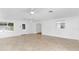 Bright and airy living room with tile floors and access to other rooms at 13724 Country Club Dr, Tavares, FL 32778