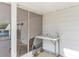 Screened porch with sink and lounge chair at 13724 Country Club Dr, Tavares, FL 32778