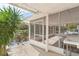 Screened porch overlooks a peaceful canal, perfect for relaxing at 13724 Country Club Dr, Tavares, FL 32778