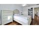 Light and airy bedroom with wood floors and built-in shelving at 1494 Walnut Way, The Villages, FL 32163