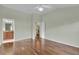 Bright bedroom with wood floors and ceiling fan at 1494 Walnut Way, The Villages, FL 32163