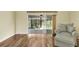 Relaxing Gathering room with hardwood floors and access to the lanai at 1494 Walnut Way, The Villages, FL 32163