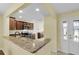 Kitchen with granite countertops and dark wood cabinets at 1494 Walnut Way, The Villages, FL 32163