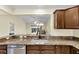 Kitchen features granite countertops and modern cabinetry at 1494 Walnut Way, The Villages, FL 32163