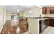 Open living space with hardwood floors and access to a patio at 1494 Walnut Way, The Villages, FL 32163